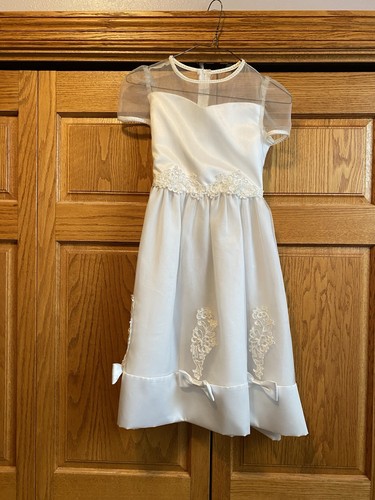 White first communion flower - first,
